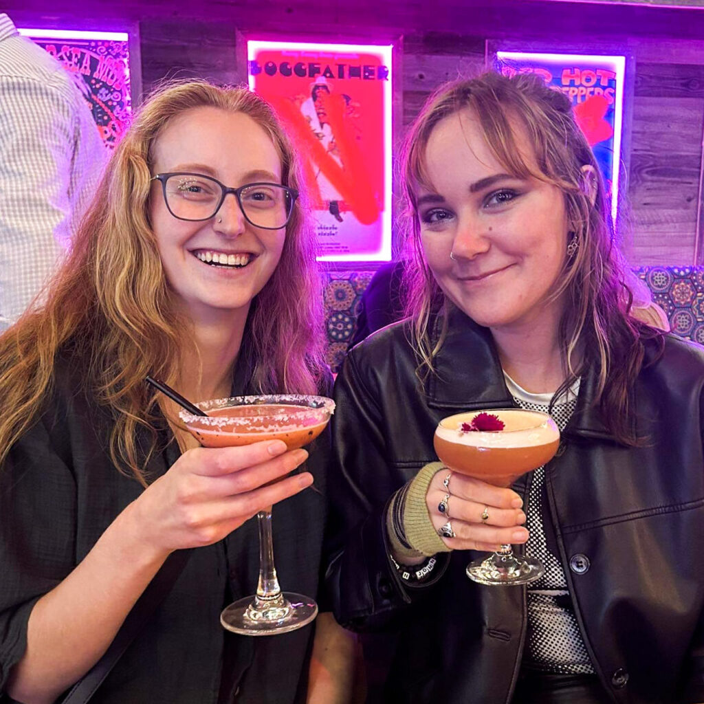 Ashley and Gabby drinking cocktails at rosies